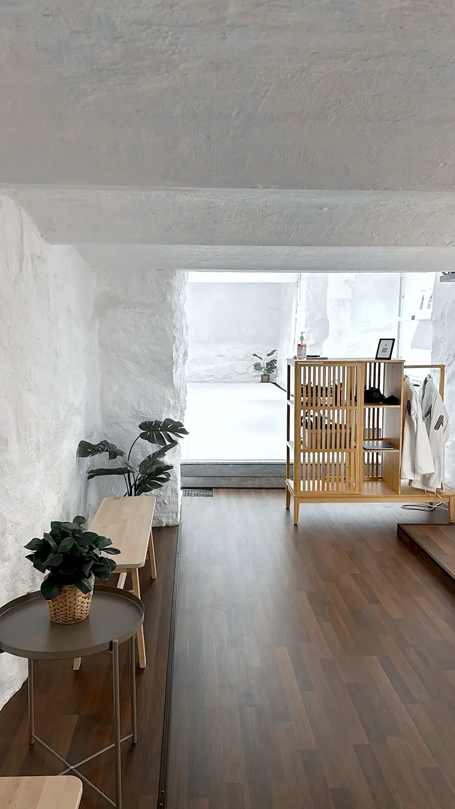 Entrance with wooden floor and shelves